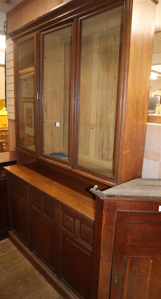 An Edwardian fielded panelled oak dresser, with glazed upper section W.148cm